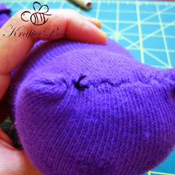 Step-6-Slip-the-stitch-in-from-the-opening Как сшить кота из носков?